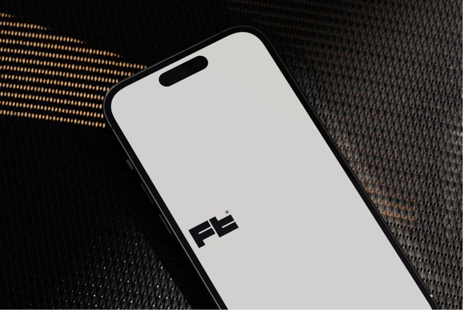 iPhone 14 Pro on textured dark fabric with gold geometric pattern overlay