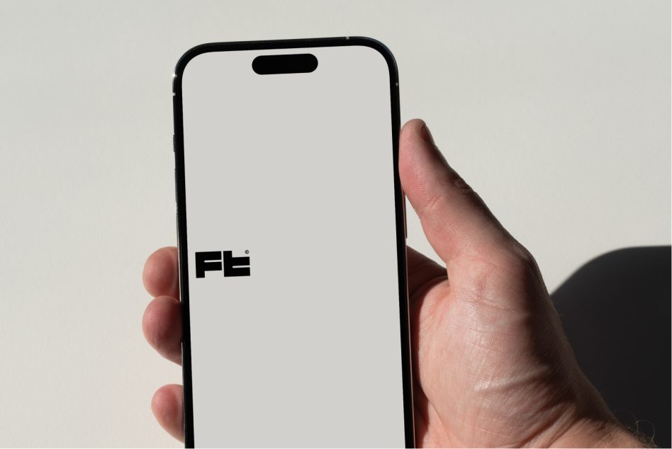 iPhone 14 Pro held vertically with clean white display, neutral background