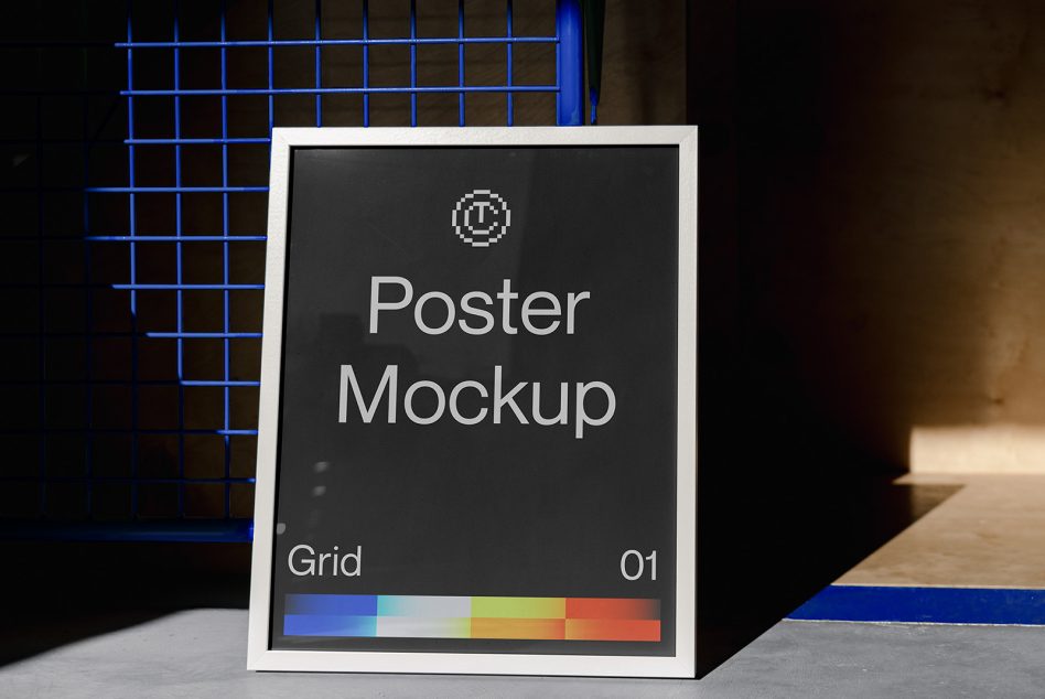 White framed poster with dark face leaning against blue grid background