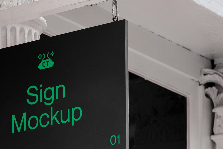 Hanging black sign mockup with bright green text in minimalist historic storefront