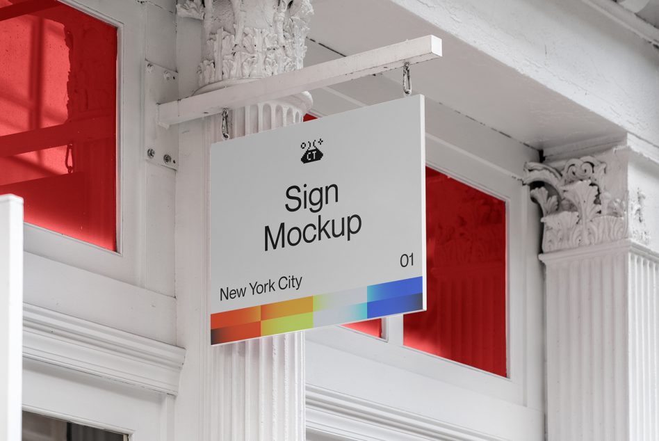 White hanging sign mockup with navy text inside ornate classical entrance hallway