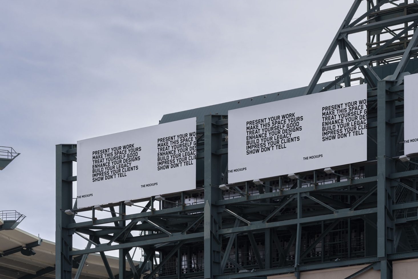 Billboard mockups on metal structure with inspirational design messages, clear sky, urban setting for advertising and graphic display.