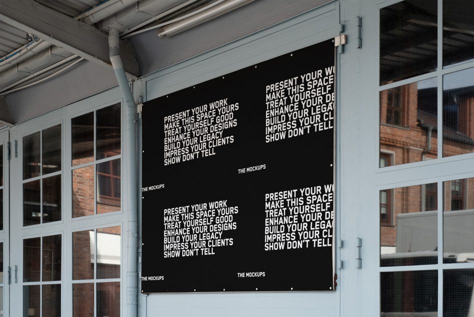 Black poster mockup with inspirational design phrases in a modern industrial setting ideal for showcasing graphic designs or font styles.