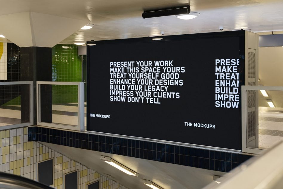 Subway station interior with dark billboard display showing white text on black