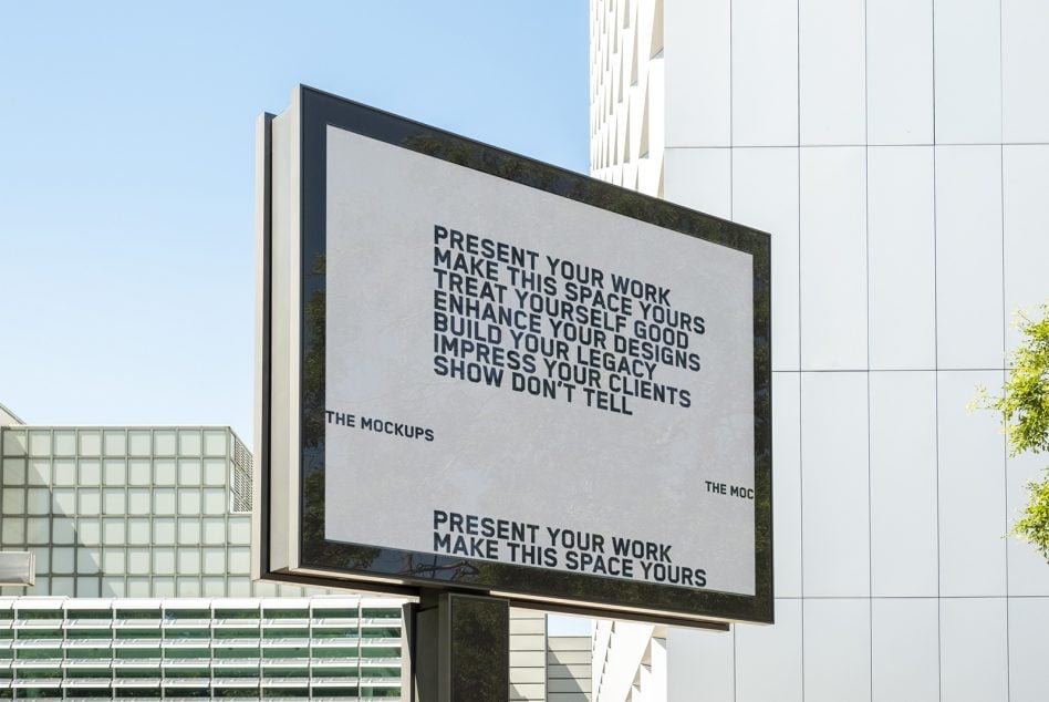Modern billboard with dark frame showing motivational text on light background outdoors