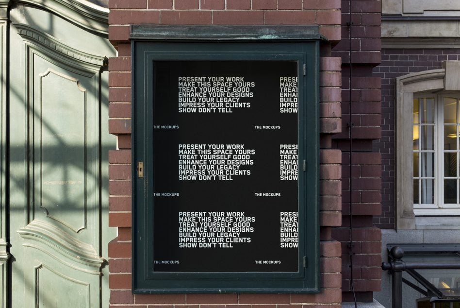 Dark green storefront window case mounted on brick with black background mockup