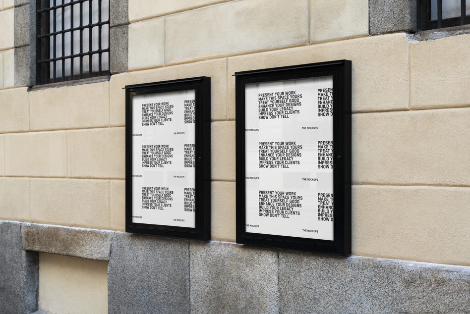 Two vertical black poster mockups on a beige wall with text overlay, ideal for showcasing graphic designs and typography in a realistic urban setting.