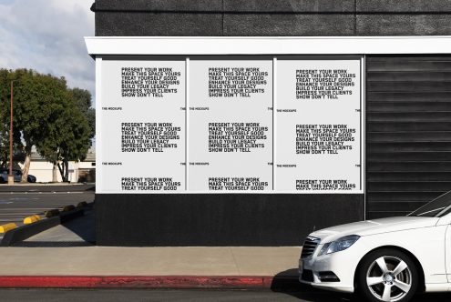 Urban billboard mockup featuring motivational design phrases and parked car, ideal for presenting advertising and design projects.