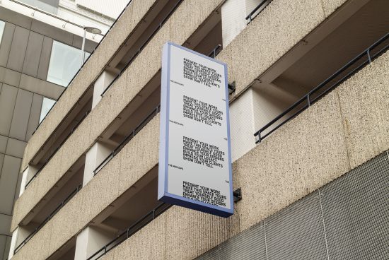 Vertical banner mockup on a building facade, urban surroundings, ideal for presentation of branding designs and advertising in a realistic scenario.