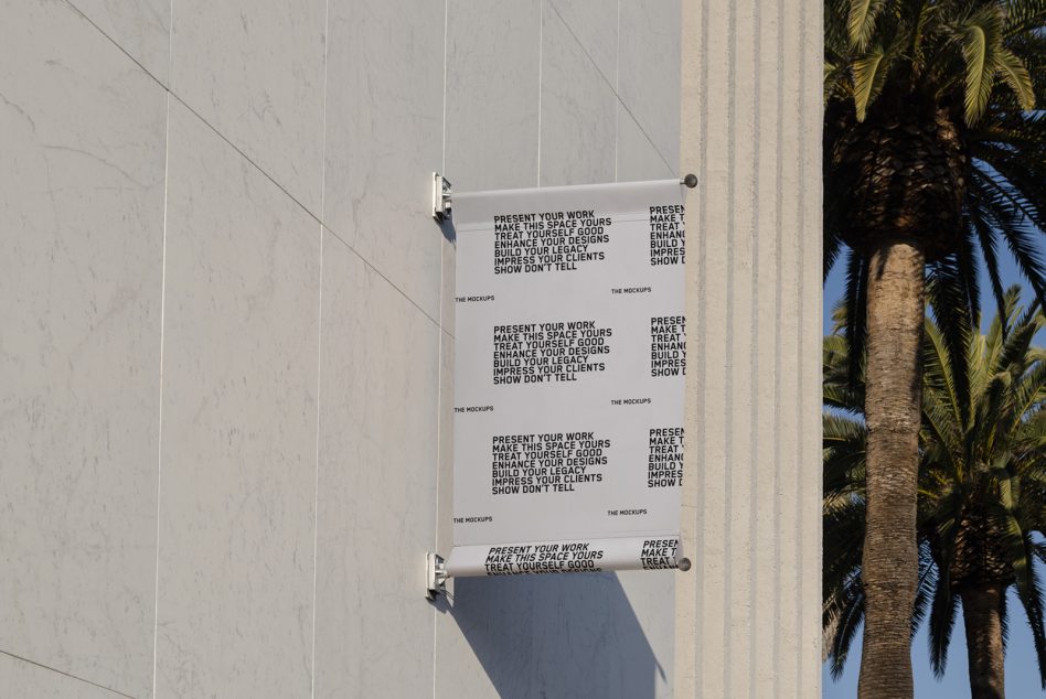 Outdoor wall poster mockup on a sunny day with clear sky and palm tree, ideal for presenting design work and advertising graphics to clients.