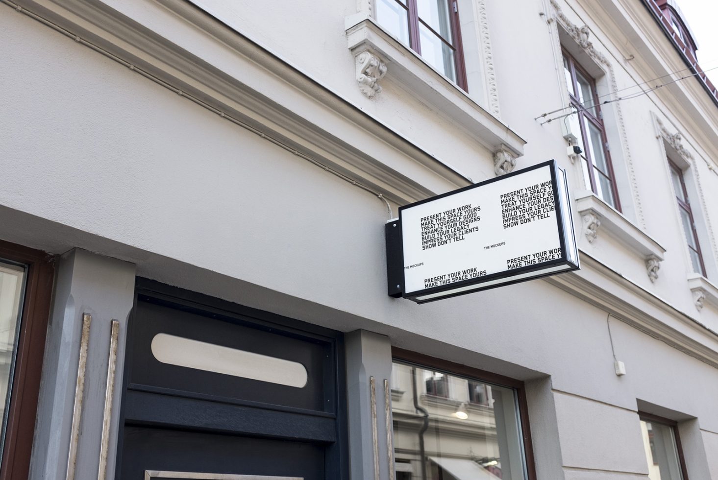 Outdoor mockup of a shop sign with QR codes hanging above a storefront, ideal for branding and design presentations for designers.