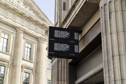 Outdoor billboard mockup on classical architecture building for advertising display, graphic design, and marketing presentations.