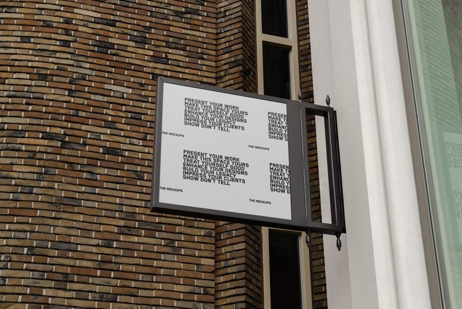 Rectangular lightbox sign on brick wall showing text grid layout in white