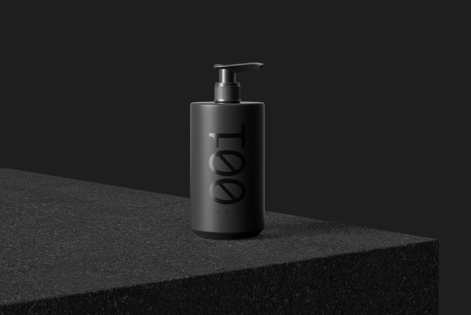 Elegant matte black soap dispenser mockup on dark textured surface, ideal for presenting branding and packaging designs.