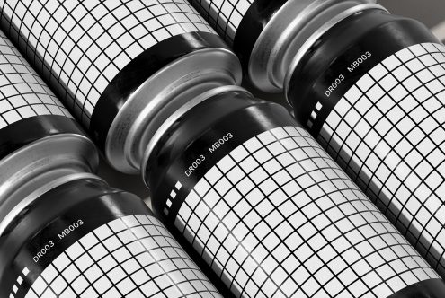 Black and white mockup of cylindrical packaging with grid pattern design for presenting branding and label designs by designers.