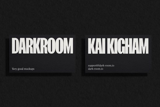 Business card mockup on black textured background featuring white bold typography design, suitable for graphic design presentations.