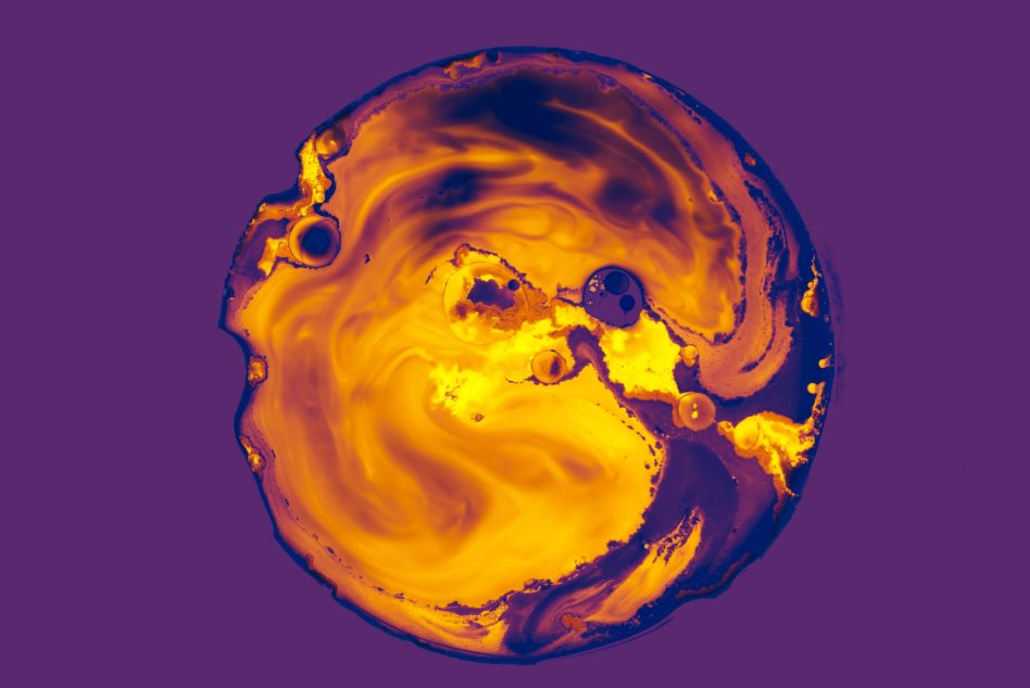 Golden flowing skull with yellow bright spots on rich purple background