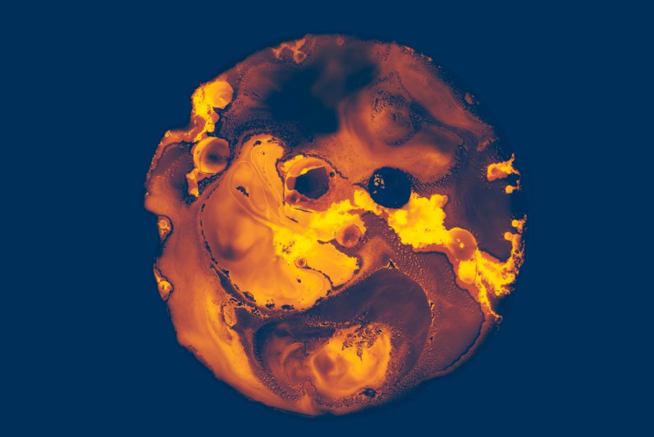 Molten skull shape glowing yellow-orange with dark void holes on teal