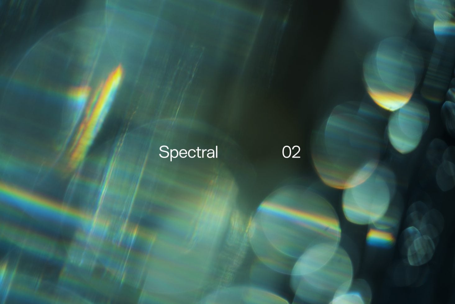 Rainbow prism refraction mixed with bokeh circles in teal, gold, blue hues