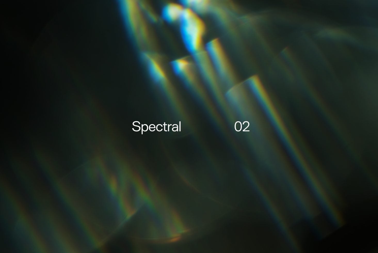Blurred light rays with blue, yellow, orange tones splitting across dark background