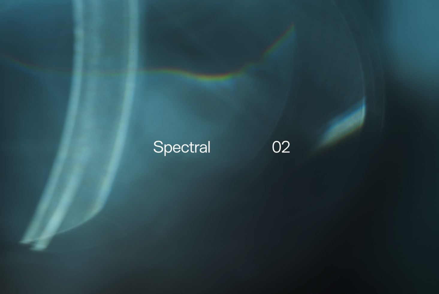 Teal colored light refraction with soft rainbow arc displaying Spectral 02