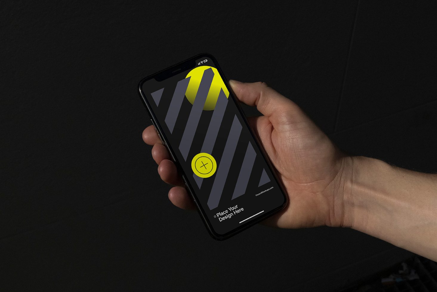 Hand holding smartphone mockup with diagonal stripe design screen on dark background, ideal for showcasing mobile UI/UX designs.