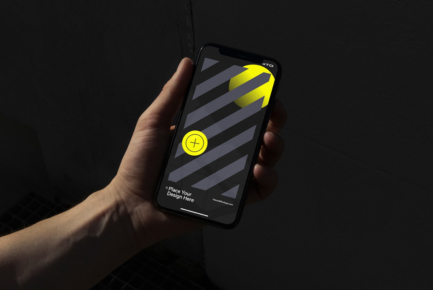 Hand holding smartphone mockup with editable screen for app design display, against a dark textured background, digital asset for designers.