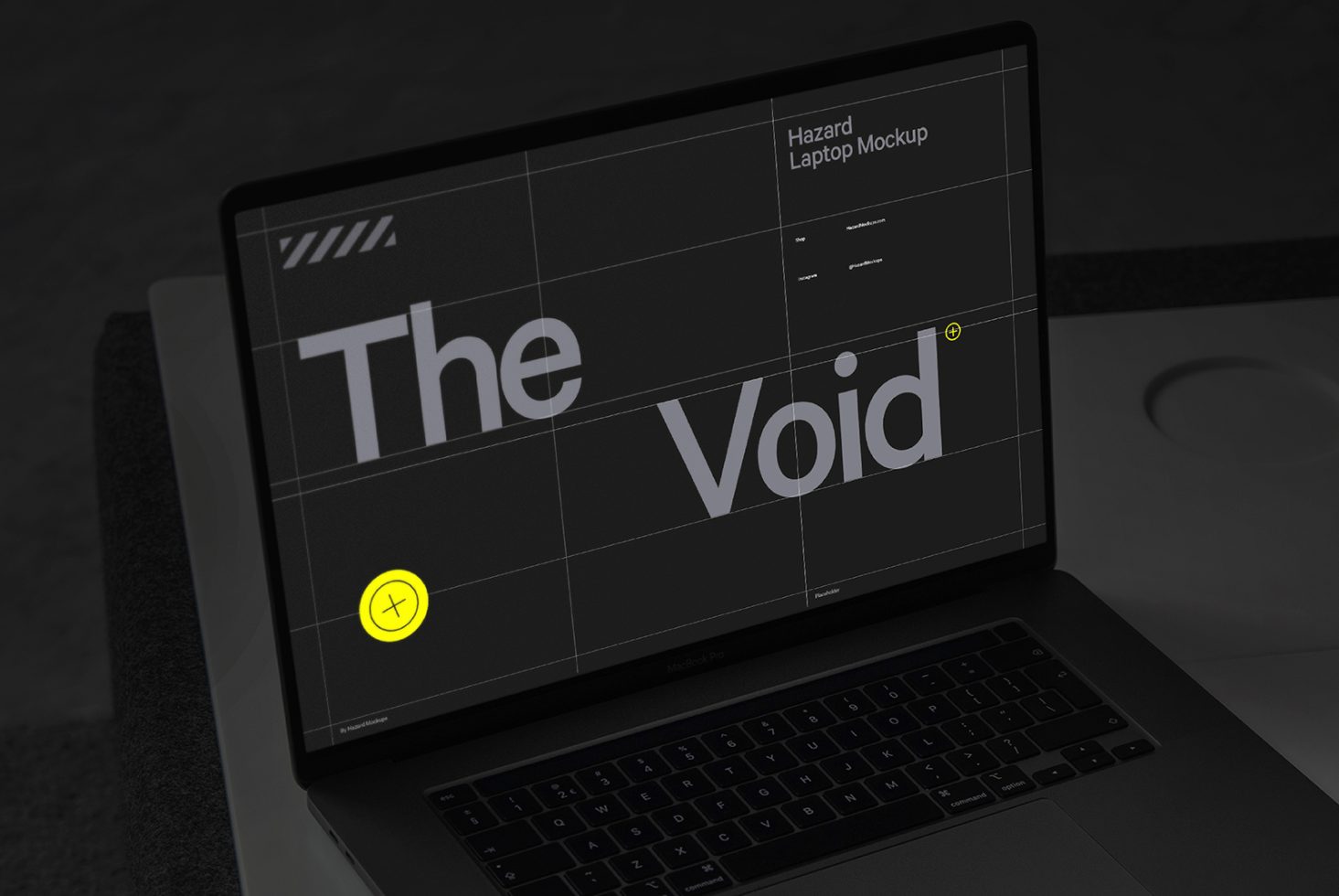 Laptop displaying bold font 'The Void' on screen, for a sleek mockup template design, ideal for branding presentations for designers.