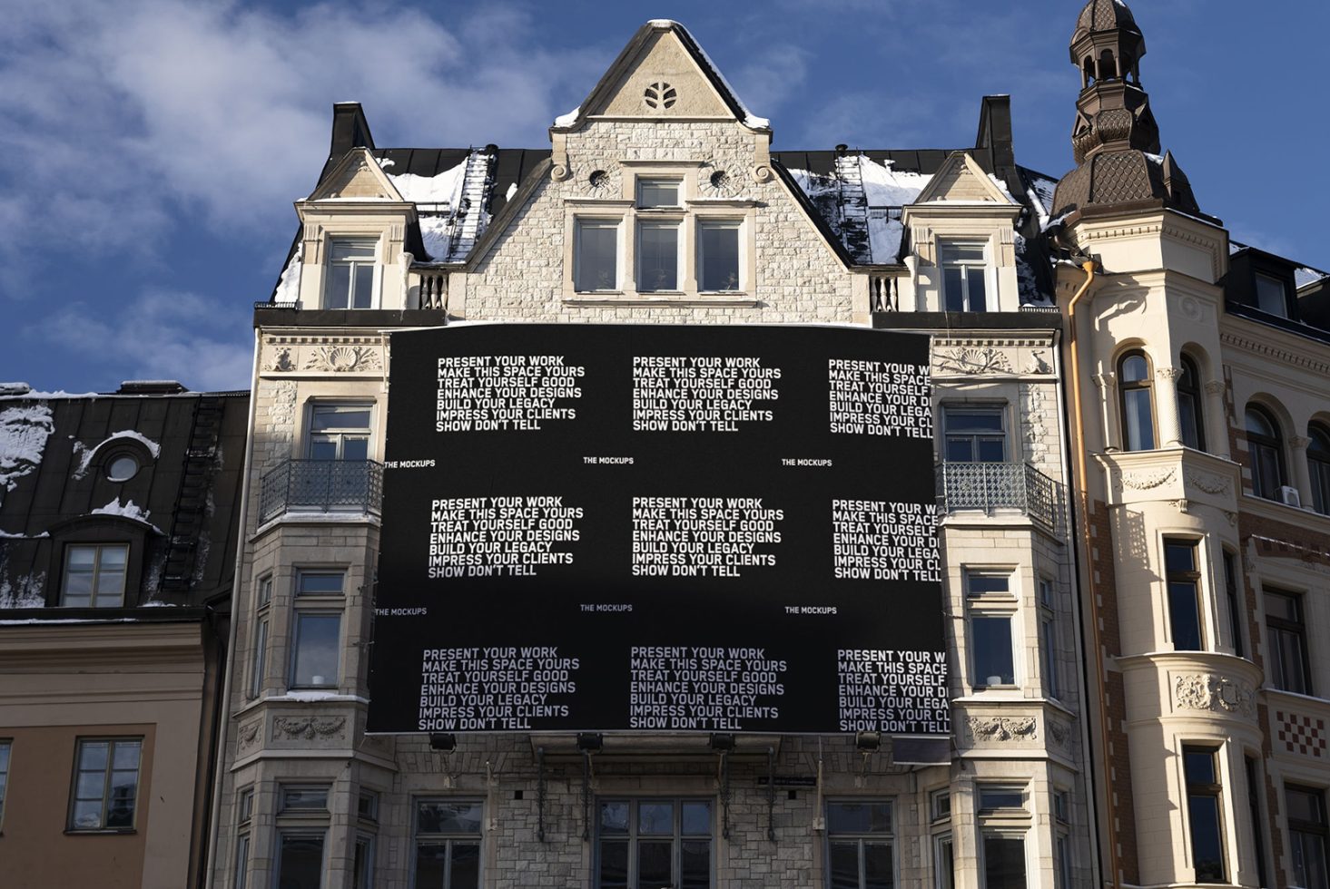 Billboard mockup on an ornate building facade for advertising presentations, clear sky, winter setting, urban environment, design asset.