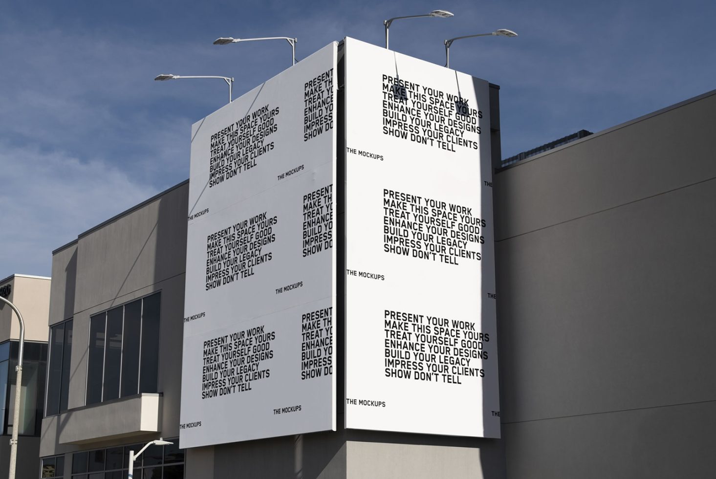 Billboard mockup on building exterior showcasing design space for ads, under clear blue sky, ideal for presentations and design display.