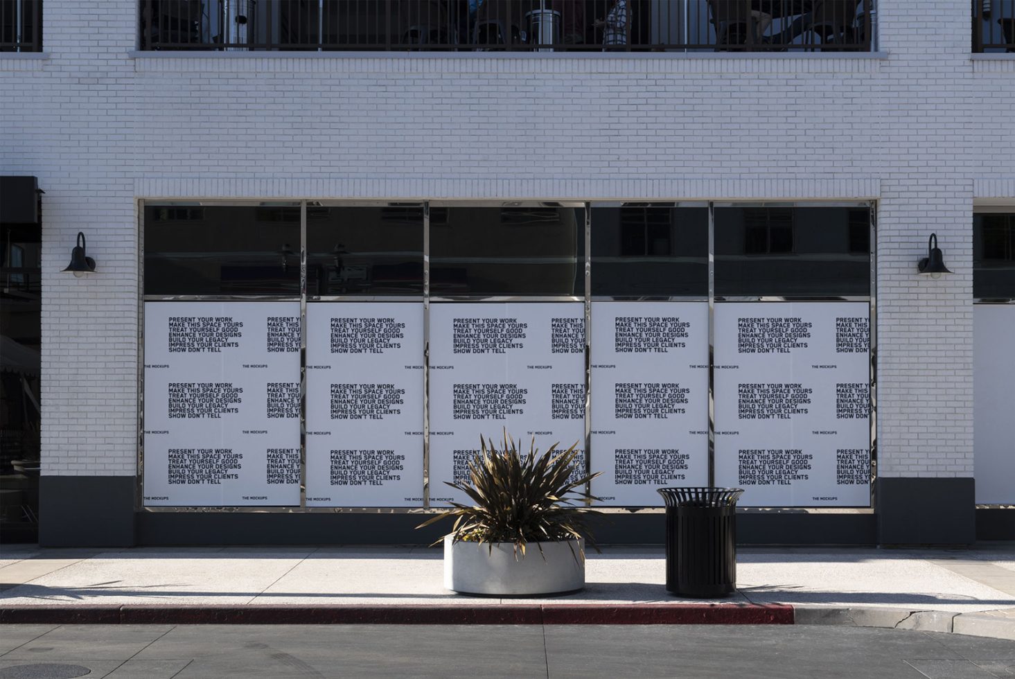 Street view of building facade with mock-up poster designs for showcasing graphic work, ideal for designers and ad templates.