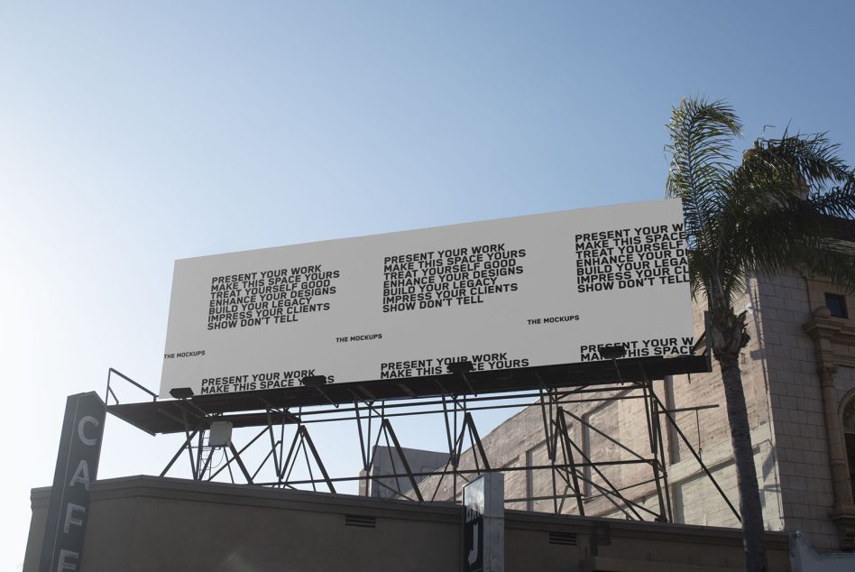 Large billboard mockup with steel frame structure against blue sky