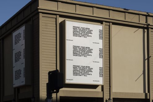 Billboard mockup on building showcasing design slogans, perfect for presentations, advertising mockups, and graphic designers.