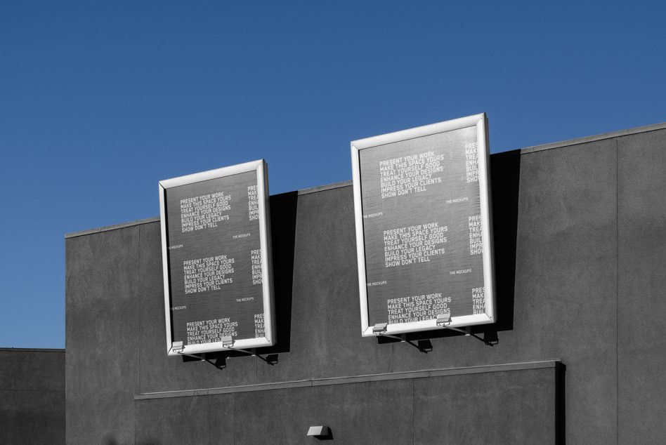 Mockup design of two large outdoor advertising billboards on a modern building, clear sky, perfect for displaying graphics and templates.