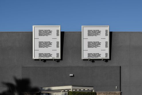 Two billboard mockups on building exterior under clear blue sky, showcasing text design, ideal for advertising presentation and design portfolio.