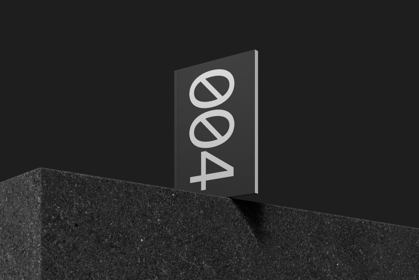 Minimalistic error 404 sign mockup on dark stone plinth for website design display, with sleek monochrome style suitable for designers.