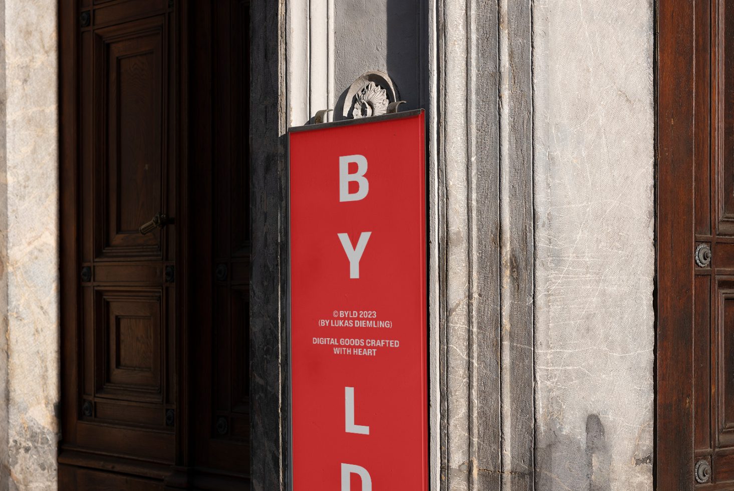 Red vertical banner mockup with white text for storefront design, displayed outside a classic wood-paneled door, showcases font and branding.