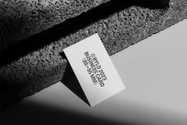 White business card mockup with stacked text on concrete backdrop