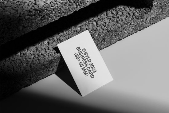 Elegant business card mockup with textured shadow, ideal for presentation of design assets to enhance branding and identity portfolios.