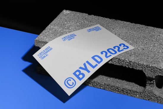 Modern letterhead mockup on textured background with blue accents, showcasing font and logo design, ideal for presentations and portfolios.