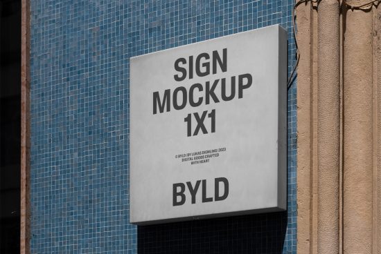 Urban exterior sign mockup 1x1 on tiled blue wall displaying design space, ideal for branding projects and graphic designers.