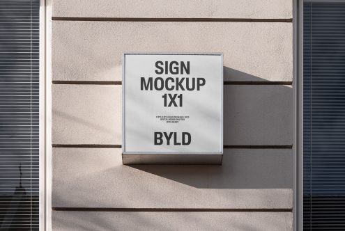 Wall-mounted square sign mockup on a textured exterior wall in natural lighting for graphic designers and advertisers.