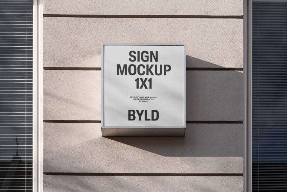 White square signage on beige building exterior showing text layout