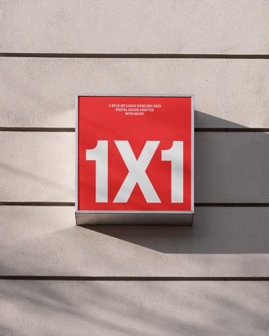 Red square outdoor sign with 1X1 text on building wall