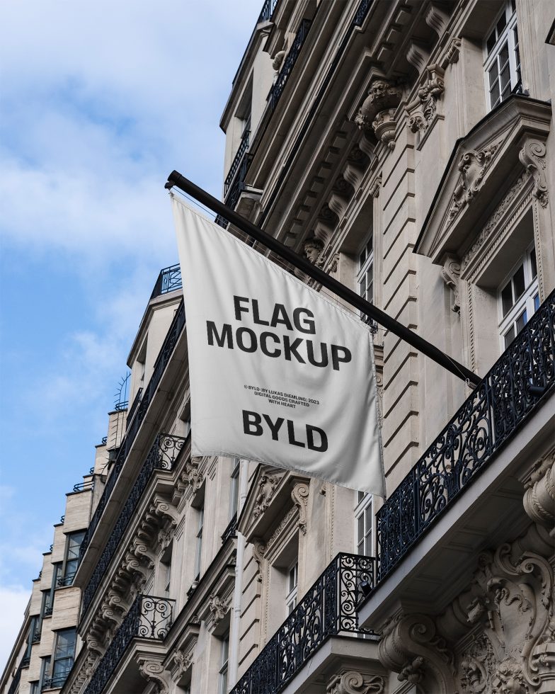 Flag mockup hanging on building facade with clear text, urban setting, for graphic design asset showcasing, in mockups category.