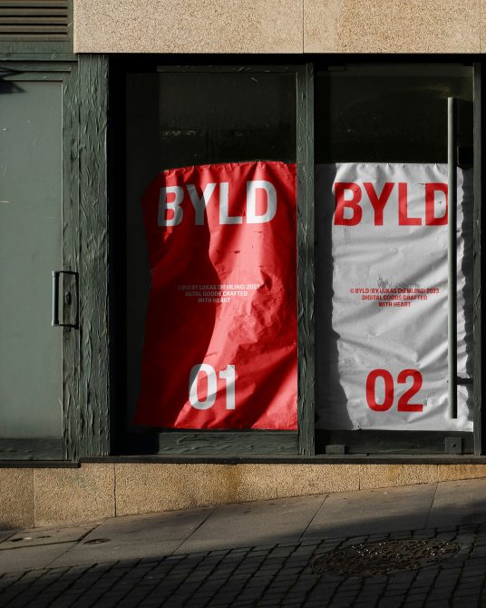 Urban poster mockup of two storefront displays with red and white designs for presentations, showcasing typography and branding elements.