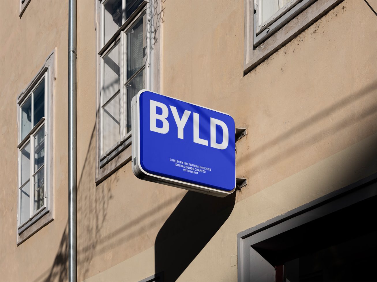 Blue street sign mockup on building exterior with clear typography, under sunlight, custom design template for graphics and branding.