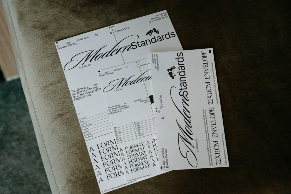 Modern Standards print mockups scattered on neutral surface