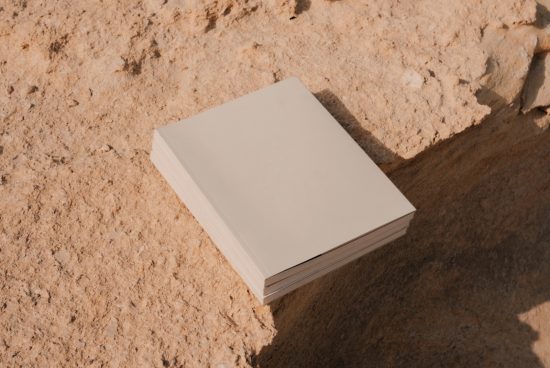 Mockup category: Blank book cover template with natural background, perfect for designers to showcase cover designs.