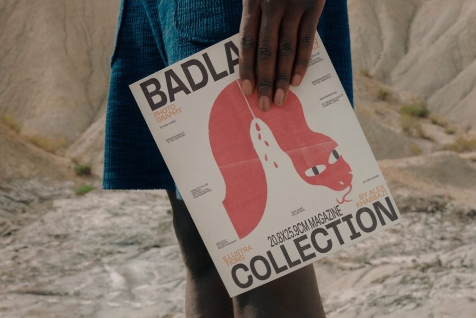 Magazine mockup with bold red shape held down at waist level